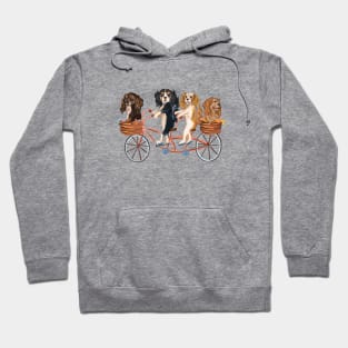 Four Cavalier King Charles Spaniels Riding a Bike Hoodie